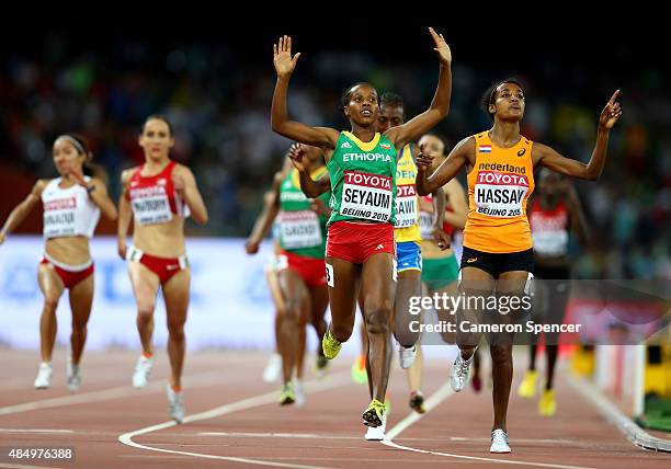 Dawit Seyaum of Ethiopia and Sifan Hassan of the Netherlands cross the finish line in the Women's 1500 metres semi-final during day two of the 15th...