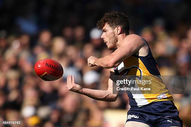 Luke Shuey of the Eagles handballs during the round 21 AFL match between the West Coast Eagles and Western Bulldogs at Domain Stadium on August 23,...