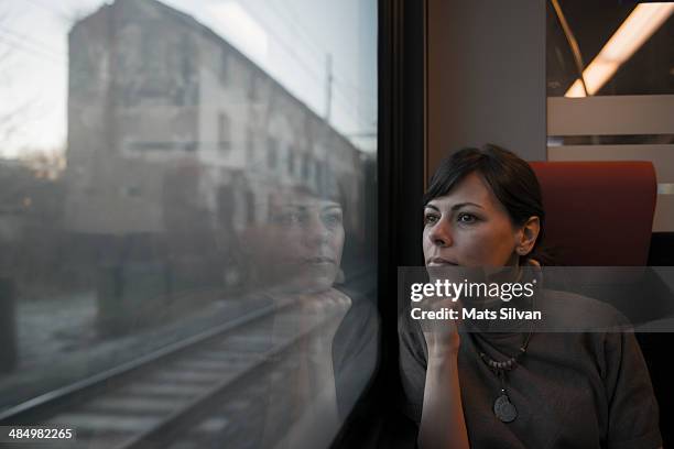 woman travel in train - train window stock pictures, royalty-free photos & images