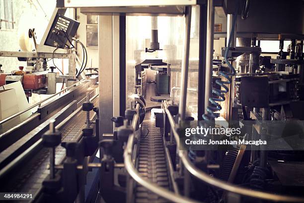 wine bottling and labeling machine - label printer stock pictures, royalty-free photos & images