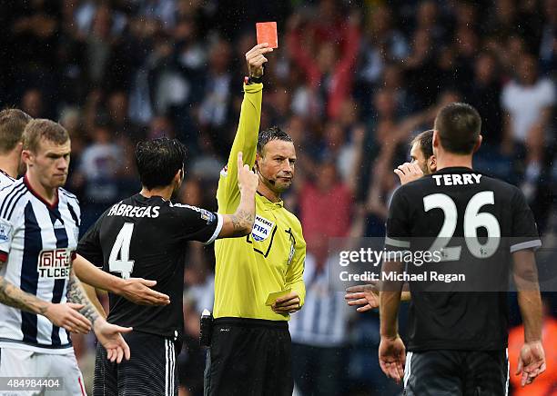 Referee Mark Clattenburg shows the red card to John Terry of Chelsea during the Barclays Premier League match between West Bromwich Albion and...