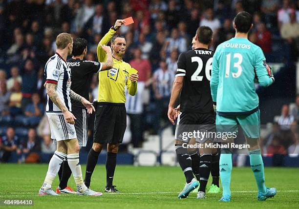 Referee Mark Clattenburg shows the red card to John Terry of Chelsea during the Barclays Premier League match between West Bromwich Albion and...