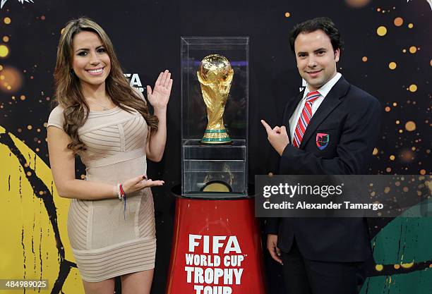 Lindsay Casinelli and Alejandro Berry pose during FIFA World Cup Trophy Tour at Univision Headquarters on April 15, 2014 in Miami, Florida.