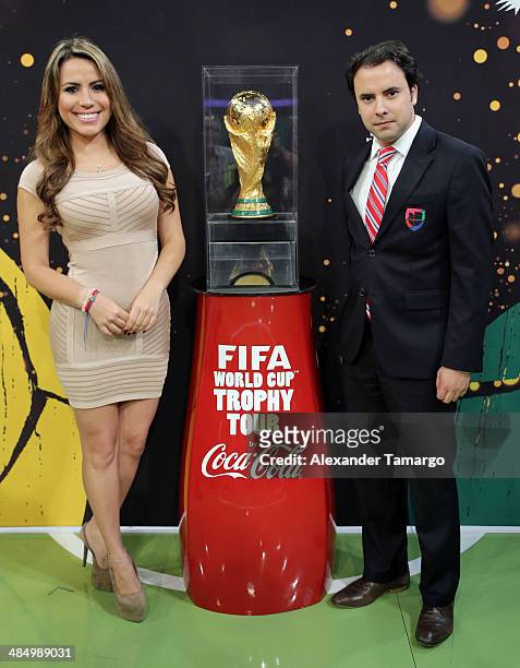 Lindsay Casinelli and Alejandro Berry pose during FIFA World Cup Trophy Tour at Univision Headquarters on April 15, 2014 in Miami, Florida.