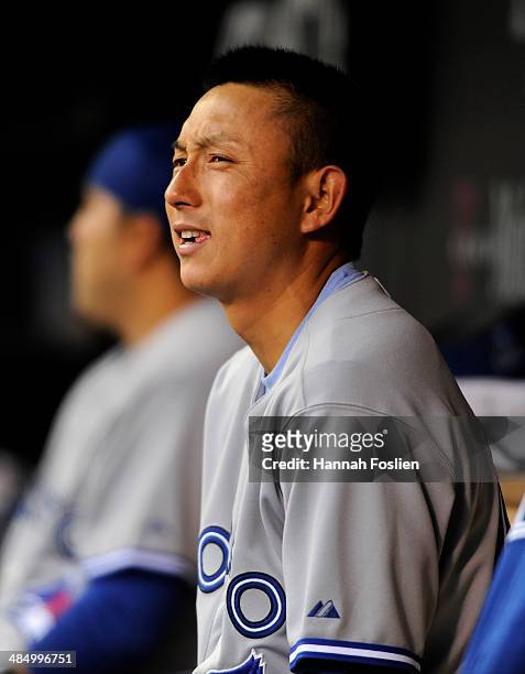 Munenori Kawasaki of the Toronto Blue Jays reacts after being called out on batter's interference during the first inning of the game against the...