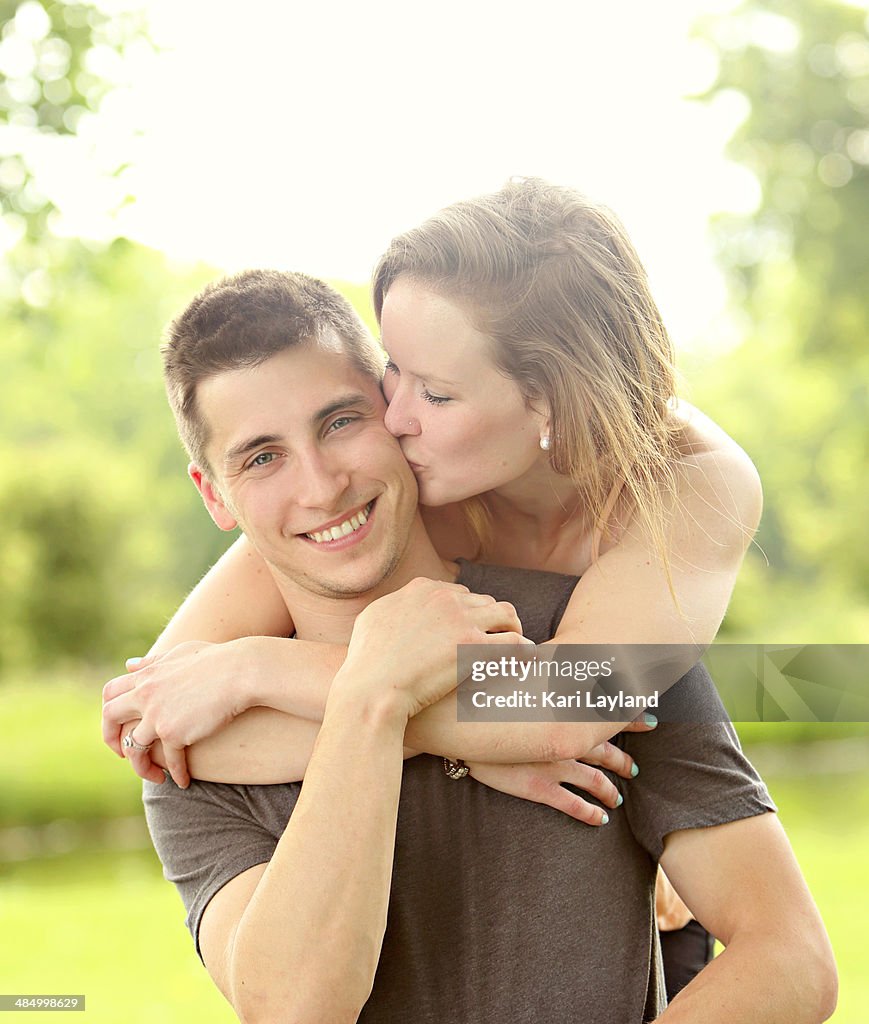 Happy Young Couple - With Kiss
