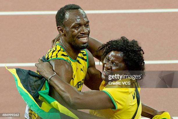 Usain Bolt of Jamaica celebrates with mother Jennifer Bolt after winning gold in the Men's 100 metres final during day two of the 15th IAAF World...