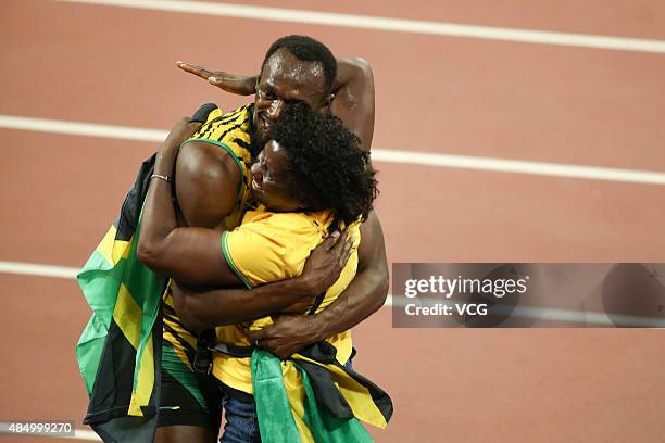 Usain Bolt of Jamaica celebrates with mother Jennifer Bolt after winning gold in the Men's 100 metres final during day two of the 15th IAAF World...