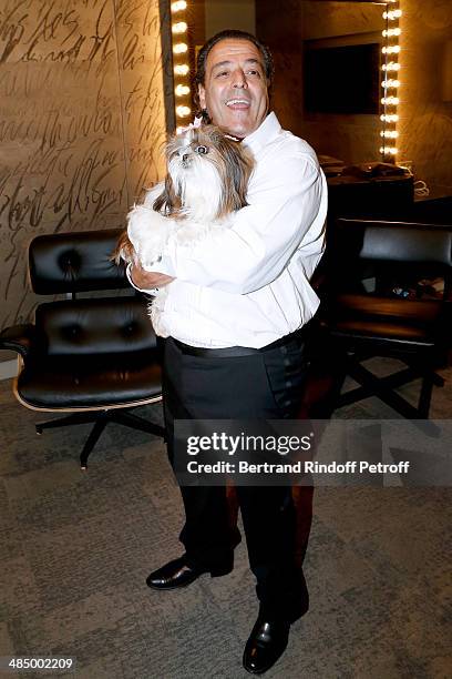 Chico poses with his dog after the Concert of 'Chico & The Gypsies' with 50 gypsy guitars at L'Olympia on April 14, 2014 in Paris, France.