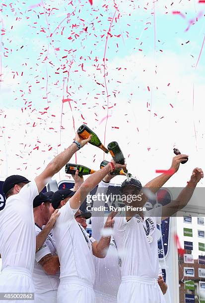 Alastair Cook of England lifts the Ashes Urn during day four of the 5th Investec Ashes Test match between England and Australia at The Kia Oval on...