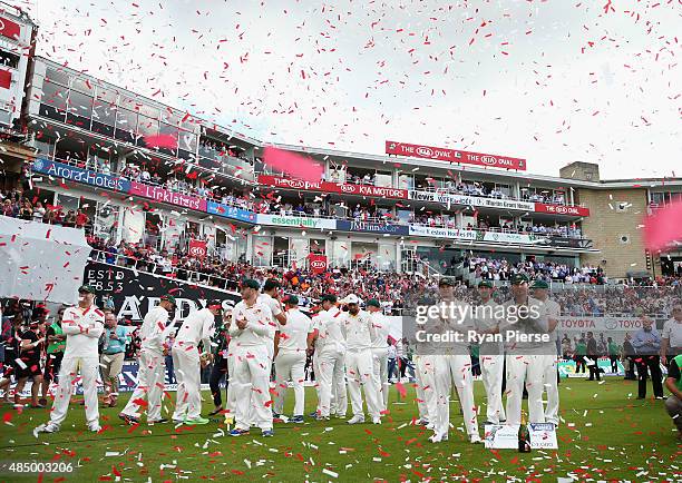 Australia look on as England lift the Ashes Urn during day four of the 5th Investec Ashes Test match between England and Australia at The Kia Oval on...