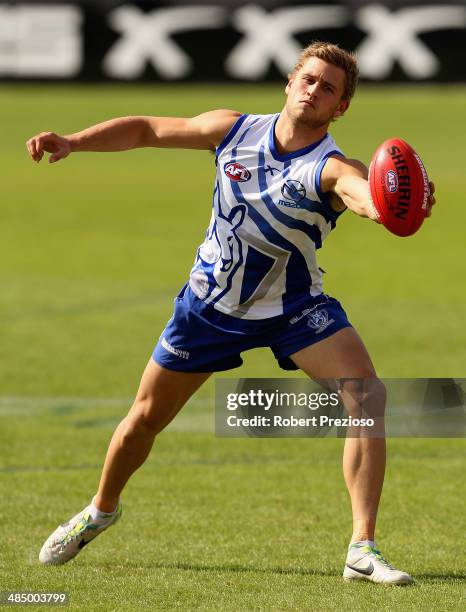 Kieran Harper gathers the ball during a North Melbourne Kangaroos training session at Arden Street Ground on April 16, 2014 in Melbourne, Australia.