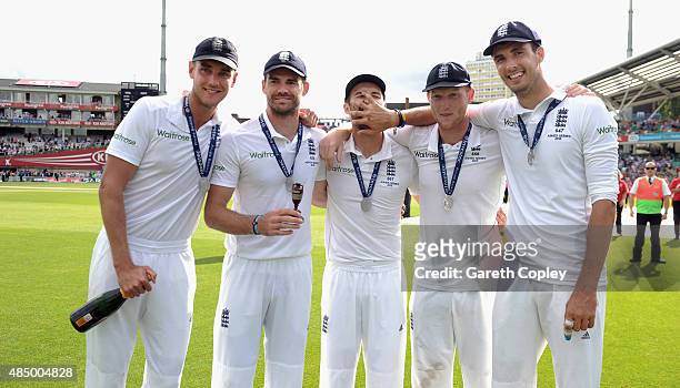 England players from left to right, Stuart Broad, James Anderson, Mark Wood, Ben Stokes and Steven Finn celebrate winning the ashes after day four of...