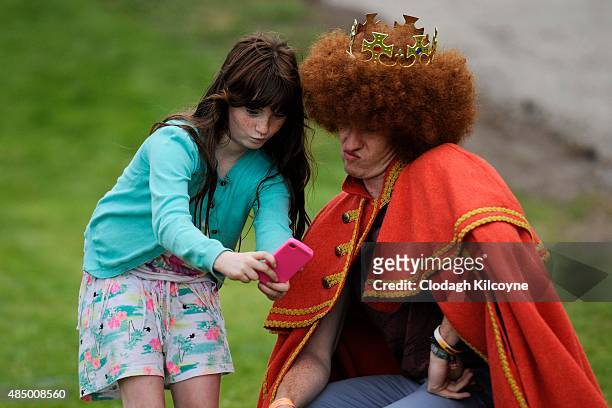 King of the Redheads, Alan Reidy poses for a picture with a child at the Irish Redhead Convention which celebrates everything to do with red hair...
