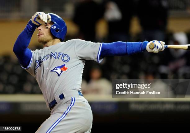 Brett Lawrie of the Toronto Blue Jays hits a grand slam against the Minnesota Twins in the ninth inning of the game on April 15, 2014 at Target Field...