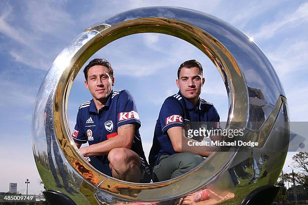Mark Milligan and James Troisi pose with the A-League Trophy at Gosch's Paddock on April 16, 2014 in Melbourne, Australia. The Victory start their...