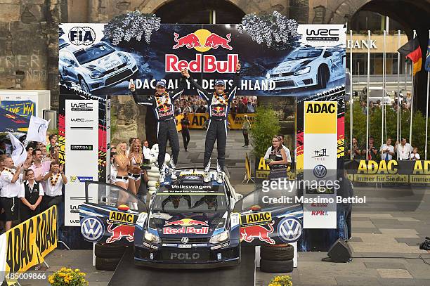 Sebastien Ogier of France and Julien Ingrassia of France celebrate their first position in the final overall during Day Three of the WRC Germany on...