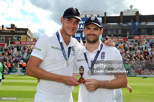 Stuart Broad and James Anderson pose with the urn as England celebrate winning the ashes after day four of the 5th Investec Ashes Test match between...