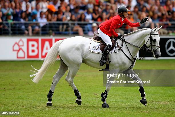 Meredith Michaels-Beerbaum of Germany celebrates after doing a good ride with her horse Fibonacci during the Rolex European Champion jumping...