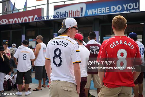 Two fans of Steven Gerrard of LA Galaxy wearing a Galaxy and Liverpool shirt outside the stadium before the MLS match between Los Angeles Galaxy and...