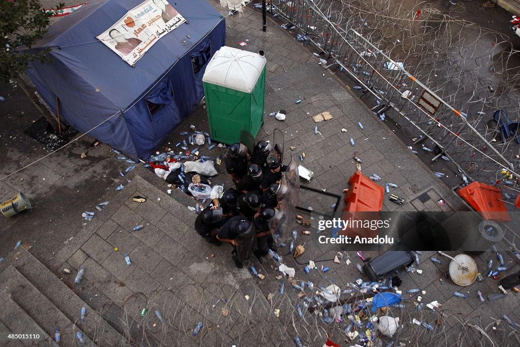 Garbage Riots Riot police stand guard in front the government house during a... News ...