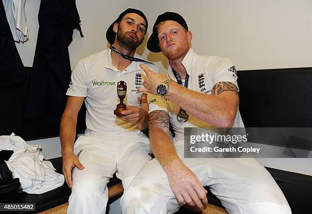 Mark Wood and Ben Stokes of England celebrate with the ashes urn in the dressing rooms after the 5th Investec Ashes Test match between England and...