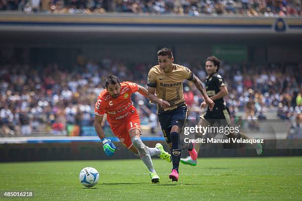 Luis Michel goalkeeper of Dorados struggles for the ball with Ismael Sosa of Pumas during a 6th round match between Pumas UNAM and Dorados de Sinaloa...