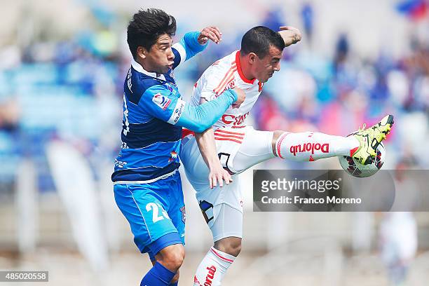 Sebastian Ubilla of U de Chile fights for the ball with Juan Abarca of San Marcos de Arica during a match between San Marcos de Arica and U de Chile...
