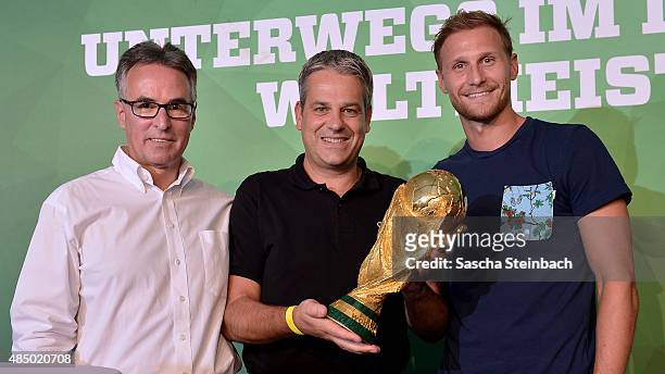 Helmut Sandrock, Manuel Neukirchner and Benedikt Hoewedes attend the closing event of the 'DFB Ehrenrunde' on August 23, 2015 in Kamen, Germany.