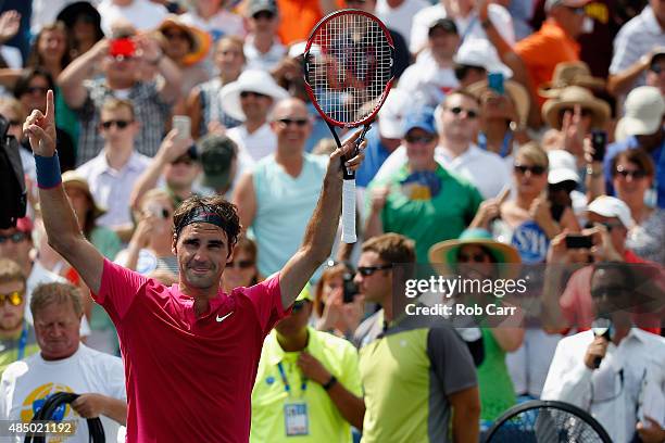 Roger Federer of Switzerland celebrates after defeating Novak Djokovic of Serbia to win the mens singles final at the Western & Southern Open at the...