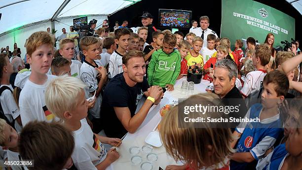 Benedikt Hoewedes is seen during the closing event of the 'DFB Ehrenrunde' on August 23, 2015 in Kamen, Germany.