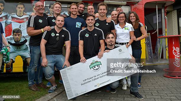 The 'Ehrenrunde' staff pose after the closing event of the 'DFB Ehrenrunde' on August 23, 2015 in Kamen, Germany.