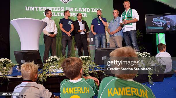 Helmut Sandrock, Benedikt Hoewedes, Stephan Brause and representatives of SV Grundhof attend the closing event of the 'DFB Ehrenrunde' on August 23,...