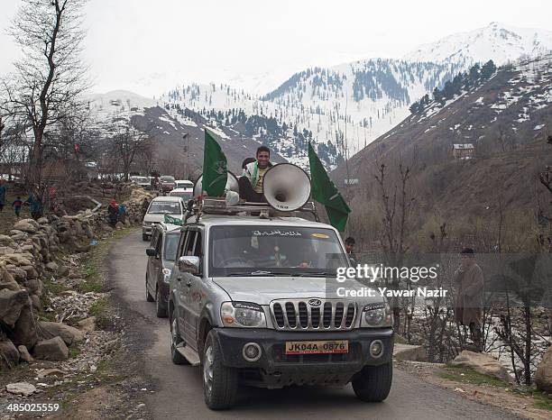 Cavalcade of Kashmir's main opposition political party, Peoples Democratic Party's leader Mehbooba Mufti, and candidate for South Kashmir passes on a...