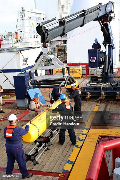 In this handout image provided by Commonwealth of Australia, Department of Defence, Phoenix Autonomous Underwater Vehicle Bluefin-21 is craned over...