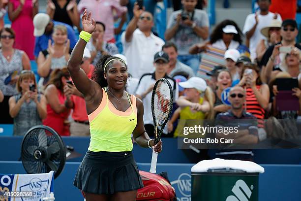 Serena Williams holds celebrates match point after defeating Simona Halep of Romania to win the womens finals of the Western & Southern Open at the...