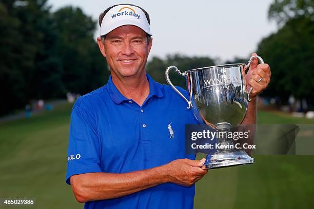 Davis Love III poses with the Sam Snead Cup after winning the Wyndham Championship at Sedgefield Country Club on August 23, 2015 in Greensboro, North...