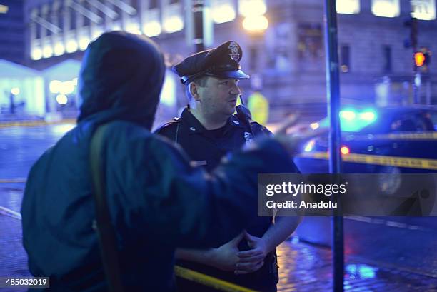 April 15 : Boston police investigate the scene of a suspicious backpacks left near Boston Marathon finish line on the first anniversary of Marathon...