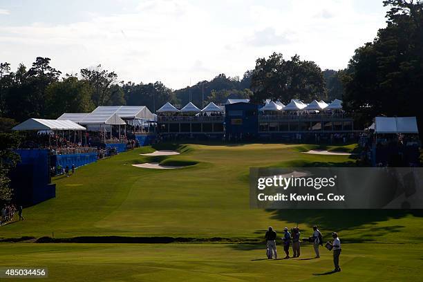 Jason Gore waits to play his second shot on the 18th hole during the final round of the Wyndham Championship at Sedgefield Country Club on August 23,...