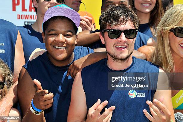 Actors Kyle Massey and Josh Hutcherson participate in the ASICS World Series of Volleyball - Celebrity Charity Match on August 23, 2015 in Long...