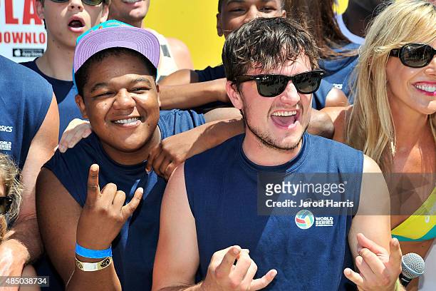 Actors Kyle Massey and Josh Hutcherson participate in the ASICS World Series of Volleyball - Celebrity Charity Match on August 23, 2015 in Long...