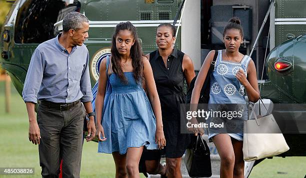 President Barack Obama , daughters Sasha and Malia and first lady Michelle Obama arrive at the White House August 23, 2015 in Washington, D.C. The...