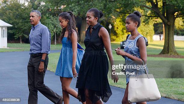 President Barack Obama , daughters Sasha and Malia and first lady Michelle Obama arrive at the White House August 23, 2015 in Washington, D.C. The...