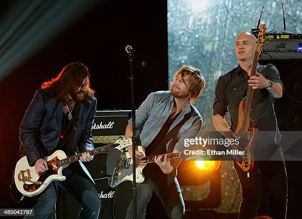 Musicians James Young, Cole Richardson and Jon Jones of the Eli Young Band perform during ACM Presents: An All-Star Salute To The Troops at the MGM...