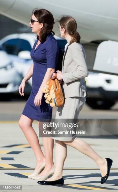 Kangaroo bag is carried by nanny Maria Teresa Turrion Borrallo as she arrives at Sydney Airport on a Australian Airforce 737 aircraft on April 16,...