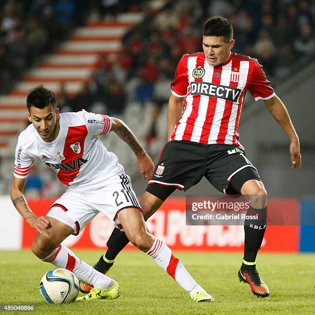 Leonel Vangioni of River Plate fights for the ball with David Barbona of Estudiantes during a match between Estudiantes and River Plate as part of...