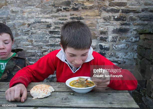 Reuben Owen has soup for lunch at Ravenseat, the farm of the Yorkshire Shepherdess Amanda Owen on April 15, 2014 near Kirkby Stephen, England. Amanda...