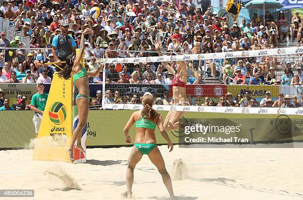 Team USA's Kerri Walsh Jennings with Team Brazil's Larissa Franca and Talita Antunes at the ASICS World Series of Volleyball - celebrity charity...