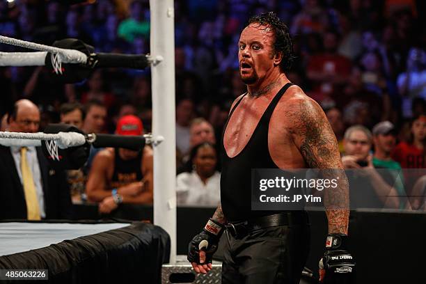 The Undertaker recovers during his fight against Brock Lesner at the WWE SummerSlam 2015 at Barclays Center of Brooklyn on August 23, 2015 in New...