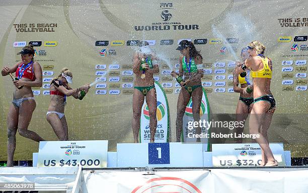 April Ross and Kerri Walsh of the USA, silver medal, Larissa Franca Maestrini and Talita Da Rocha Antunes of Brazil, gold medal and Kira Walkenhorst...